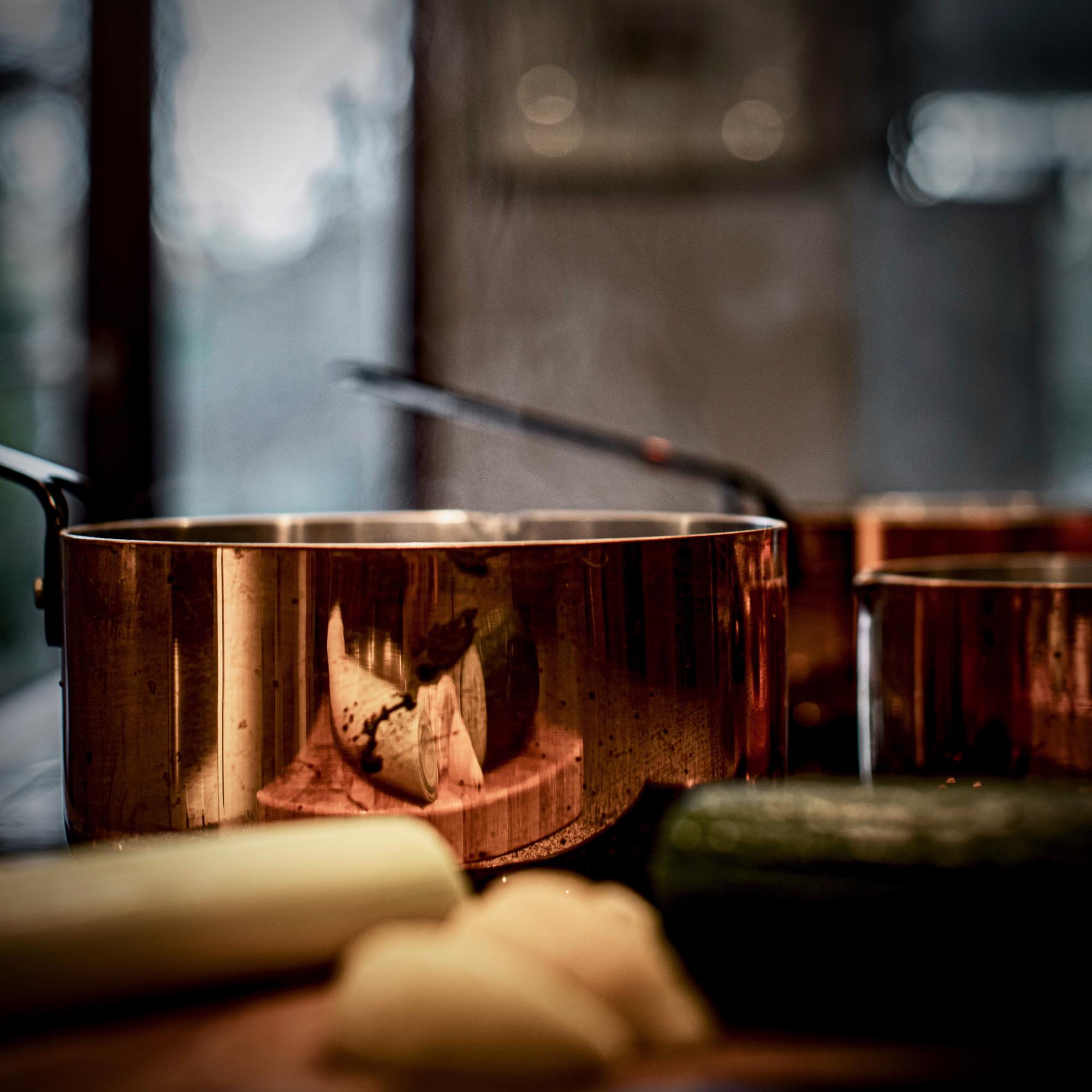Interior of a boutique culinary atelier with copper pans