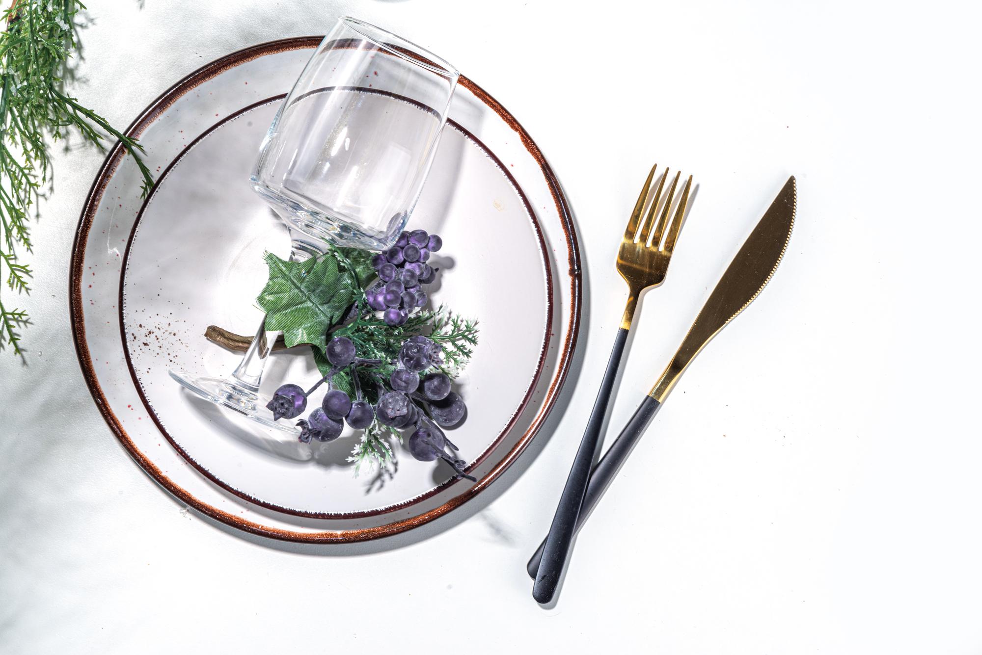 Large plated tasting menu on a wooden table